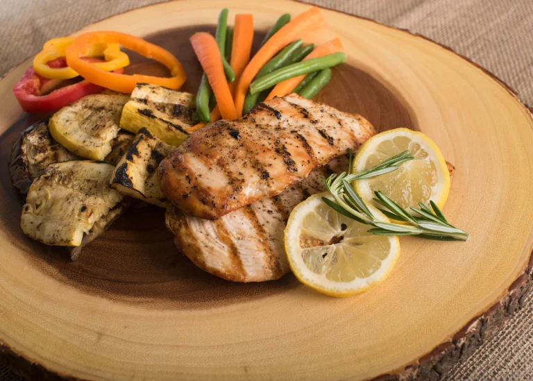 Seared chicken served with cherry tomatoes and fresh herbs.